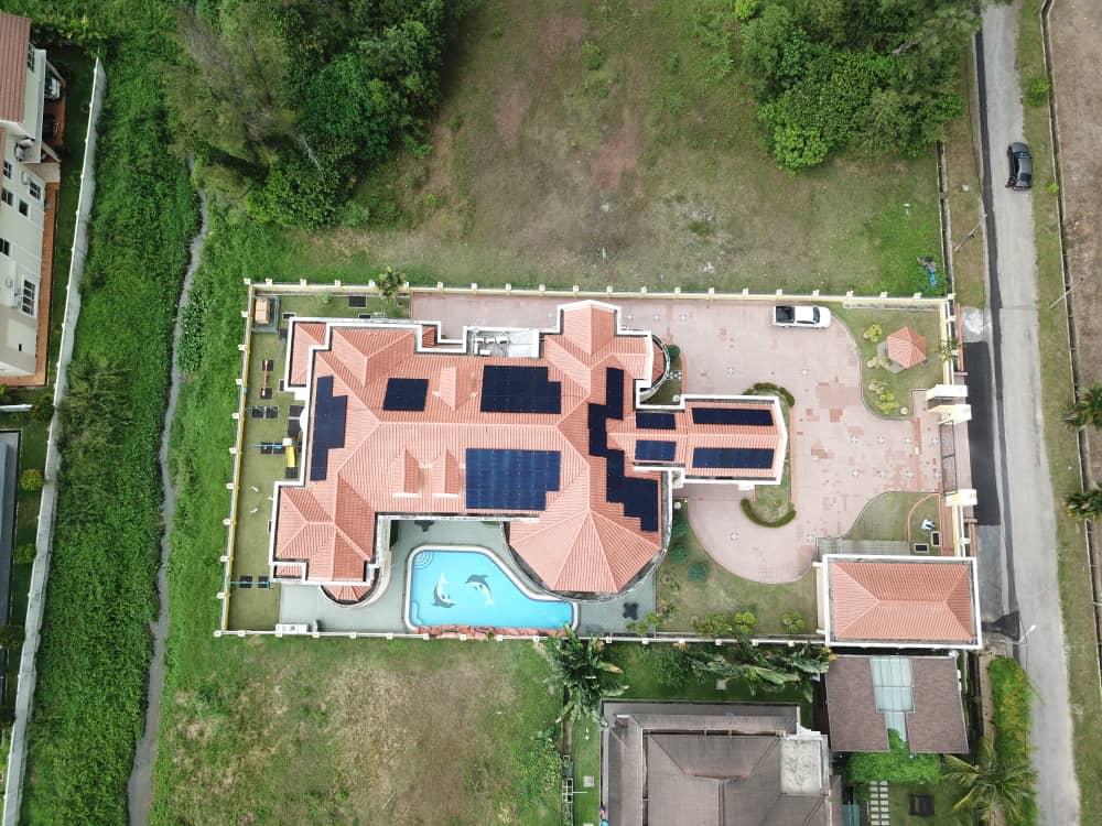 Solar panels on a bungalow roof in Kajang, aerial view
