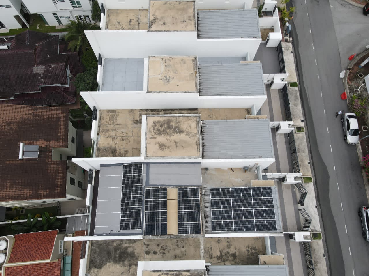 Solar panels on the roof of a semi-detached house in Ampang, aerial view